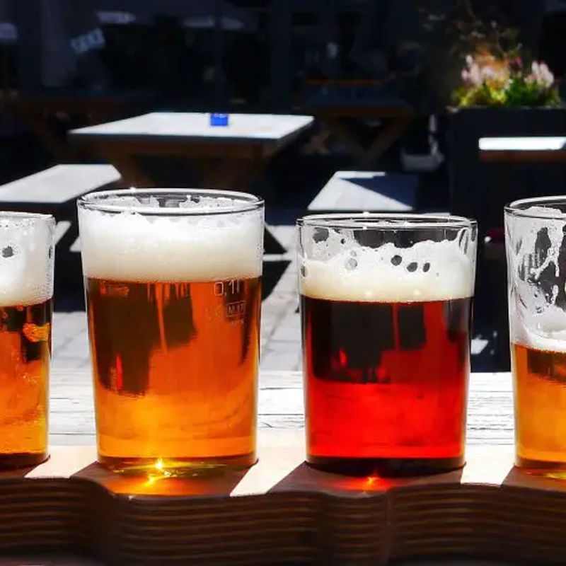 A couple of IPA beers outside on a table